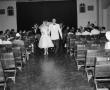 Primary view of [Bride and groom walking down the aisle]