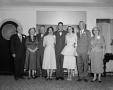 Photograph: [Bride and groom with a group]