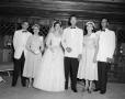 Photograph: [Bride and groom with their parents]
