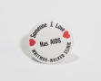 Photograph: ["Someone I Love Has AIDS, Whitman-Walker Clinic" button]