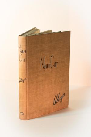 A dirty orange book, propped up and seen from the spine and front cover. The title is on the cover at the top in black.
