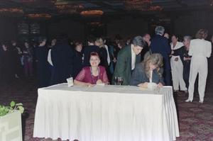 Primary view of object titled '[Feleshia Porter at table]'.