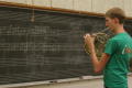 Photograph: [Student playing chalkboard score]