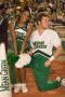Photograph: [NT Cheer pair resting during Homecoming game, 2007]