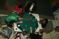 Photograph: [Students around game table set-up for Casino Night]