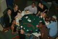 Photograph: [Students looking up from game table during Casino Night]