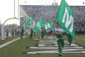Photograph: [Spirit flag runners at the UNT v Navy game]