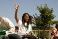 Photograph: [Person waving from float in UNT Homecoming Parade, 2007]