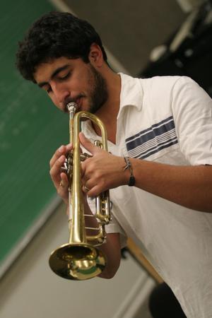 Primary view of object titled '[Student practicing trumpet in class]'.