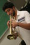 Photograph: [Student practicing trumpet in class]