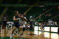 Photograph: [NT Women's Basketball player against FIU player]