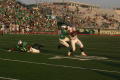 Thumbnail image of item number 1 in: '[UNT player attempting to tackle FAU player, September 22, 2007]'.