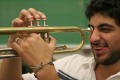 Photograph: [Student posing with trumpet in class]