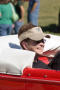 Photograph: [An official in a red car in Homecoming Parade, 2007]