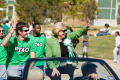 Photograph: [Gretchen Bataille riding in car for UNT Homecoming parade, 2007]