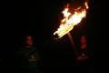 Photograph: [Talons members lighting each others torches]