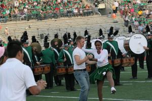 Primary view of object titled '[NT Dancers performing during halftime at the UNT v Navy game]'.
