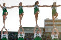 Photograph: [Cheer team doing stunt together at Homecoming game, 2007]