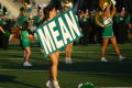Photograph: [Cheerleader holding MEAN sign, October 13, 2007]