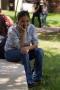 Photograph: [UNT student sitting and speaking on cell phone]