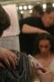 Primary view of [Makeup artist painting actor's hair]