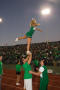 Primary view of [Cheer team and alumni at Homecoming game, 2007]