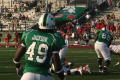 Photograph: [UNT players running towards tackle, September 22, 2007]
