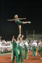 Photograph: [NT Cheer flier doing arabesque at UNT v ULM game]