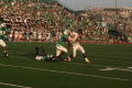 Photograph: [UNT players attempting to tackle FAU player, September 22, 2007]