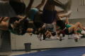 Photograph: [NT Cheer team practicing flips]