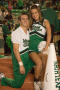 Primary view of [Two NT Cheer pairs at rest during Homecoming game, 2007]