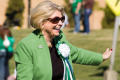 Photograph: [Gretchen Bataille waving during UNT Homecoming parade, 2007]