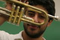 Photograph: [Student posing with trumpet]