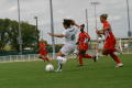 Photograph: [Brittany Cleveland going to kick the ball]