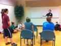 Photograph: [Self-defense instructor speaking to participants]