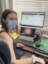 Primary view of [Student wearing a face mask at their desk]