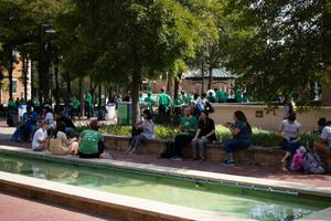 Primary view of object titled '[Students seated around the fountains of the Library Mall]'.