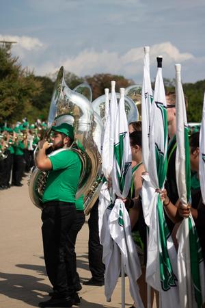 Primary view of object titled '[Trombone player and the North Texas Dance Team]'.