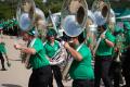 Photograph: [Trombone players marching together]
