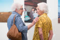 Primary view of [Joyce Bankston with exhibit attendee]