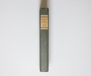 Faded bluish book cover, seen from the spine. The title is at the top of  the spine in a white label.