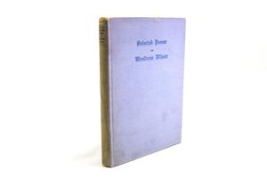 A light purple, worn book cover. The title page is a the top in blue letters.