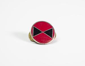 A circular red pin with two black triangles inside.