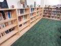 Photograph: [Bookcases along the wall in MC office]