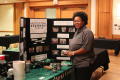 Photograph: [Cheylon Brown at New Faculty Orientation booth]