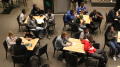 Photograph: [Students gathered at tables in Syndicate 1]