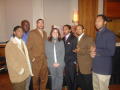 Photograph: [Andrea Robledo and men at 2005 Black History Month event]