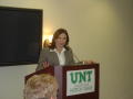 Photograph: [Woman speaking at UNT banquet]