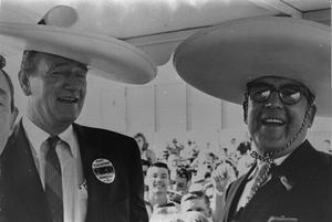Primary view of object titled '[Frank Cuellar Jr. and John Wayne]'.