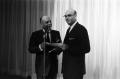 Photograph: [Stanley Marcus presenting a certificate, 2]